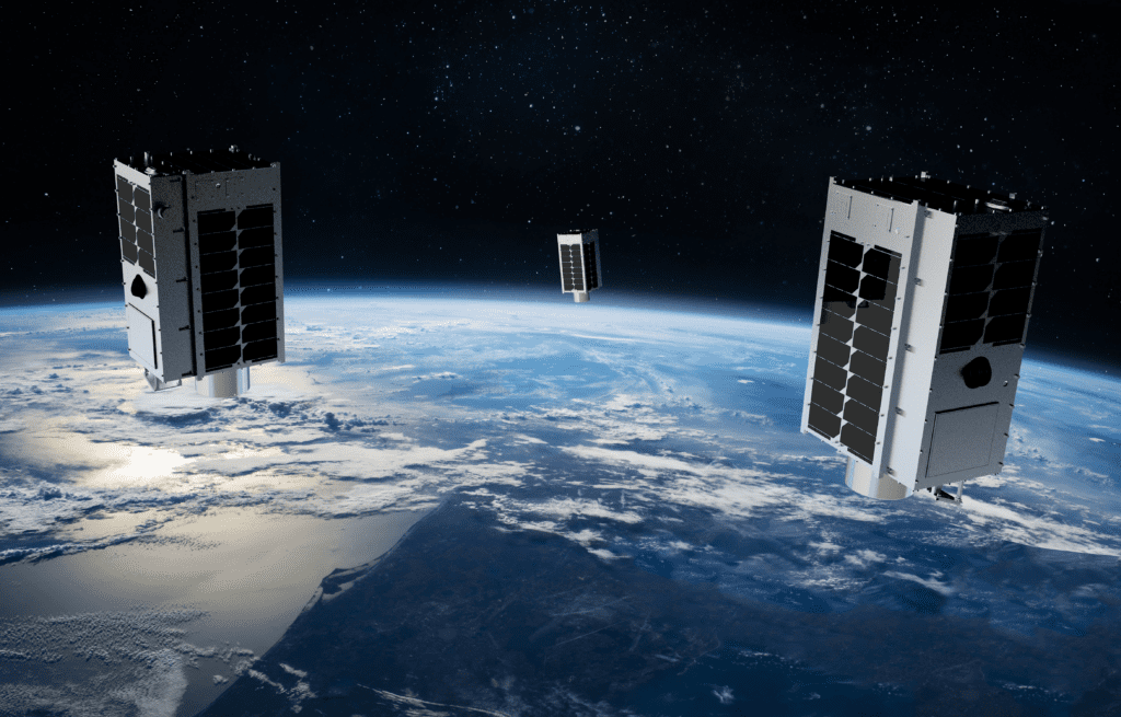 Three GHGSat satellites orbiting across Earth